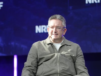 Debenhams Group CEO Dan Finley seated on stage at NRF Europe in Paris