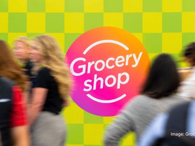 Shoppers walking past the Groceryshop logo at Groceryshop 2026 in Las Vegas