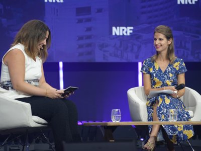 Charlotte Delmas of Lagardère Travel Retail and Lucy Barclay of Asana on stage at NRF Europe in Paris