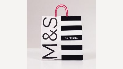 M&S and Sephora branded shopping bag with black-and-white stripes and pink handles