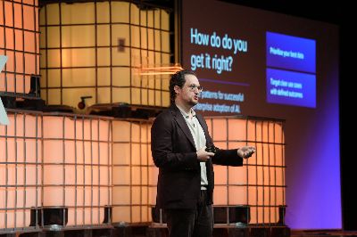 Merkle Global Chief Strategy Officer Holden Bale on stage at Shoptalk Europe in Barcelona, presenting the five patterns for successful enterprise AI adoption.