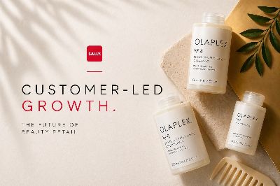 Sally Beauty branding alongside Olaplex hair care products on a warm neutral surface
