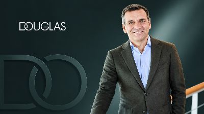 DOUGLAS Group CEO Sander van der Laan editorial portrait with DOUGLAS wordmark