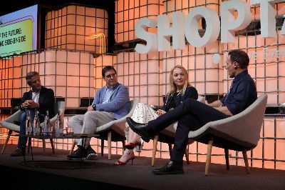 Panel of Jordan Berke, Jordi Bosch, Beyza Kapu and Przemek Czarnecki on stage at Shoptalk Europe in front of the SHOPTALK backdrop.