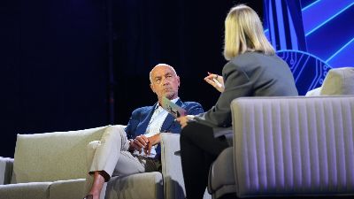 Christian Louboutin CEO Alexis Mourot seated on stage during a fireside chat with Shoptalk's Rebecca Bemhena.